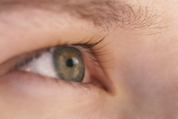 green teen girl eye closeup side view