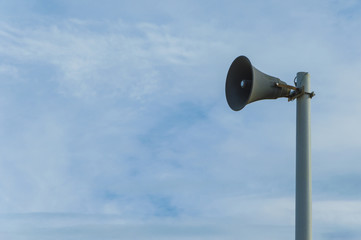 Isolated magaphone in a blue sky background