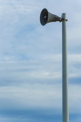 Isolated magaphone in a blue sky background