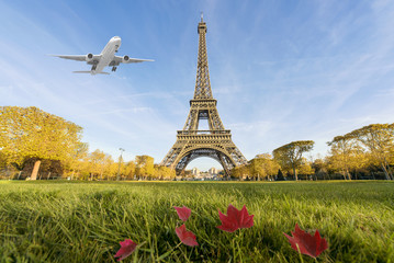 Airplane flying over Eiffel Tower, Paris, France.  - Powered by Adobe
