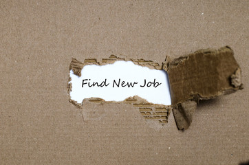 The word find new job appearing behind torn paper
