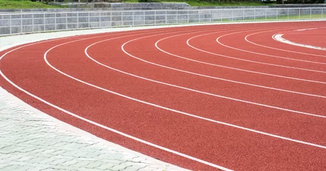 Gordijnen running track in stadium. © Chayanin Wongpracha