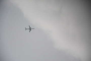 Plane flying in stormy cloud