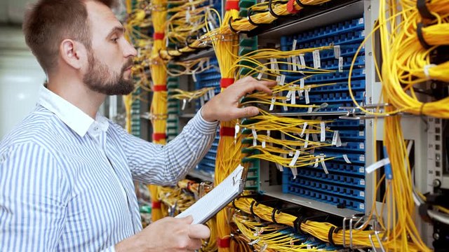 Engineer working in data room.