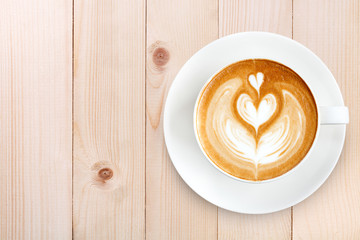 Top view latte art coffee on wood background