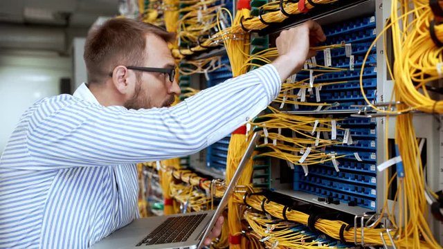 Engineer working in data room.