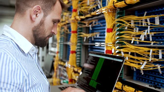 Engineer working in data room.