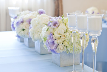 Nicely decorated wedding table with flowers and candles 