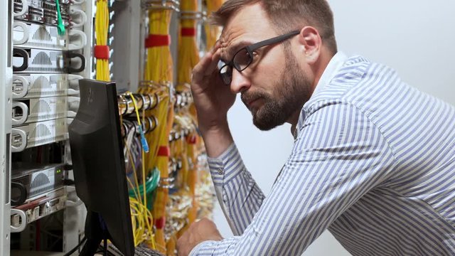 Engineer working in data room.