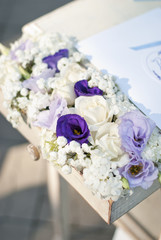 Vintage old table and flowers.White and blue bouquet 