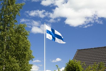 Flag of Finland on blue sky background.