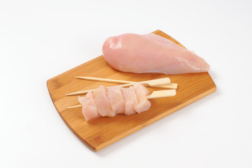 raw chicken breast and skewers