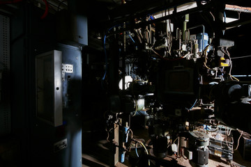 Old factory machinery in a dark room with less light © JRstock