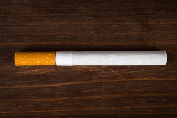 Cigarette on a wooden table