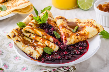 Crepes with forest berries and caramel