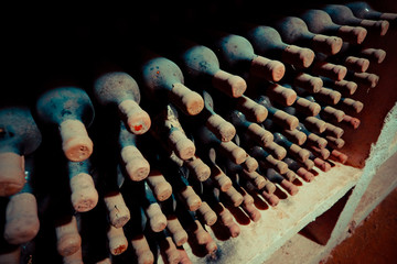 Old wine bottles in cellar. Old wine cellar in the Republic of M