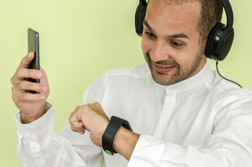 man in shirt uses a smart watch