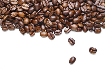 vibrant, dry, roasted coffee beans on white background, copy space