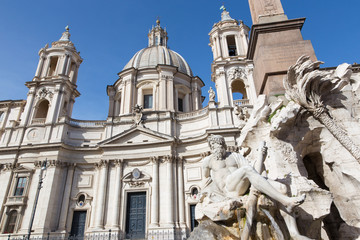 Fototapeta na wymiar Rome - Piazza Navona in morning and Fontana dei Fiumi by Bernini and Santa Agnese in Agone church. The statue of Ganga river by Claude Poussin (1651).