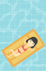 Woman relaxing in swimming pool.