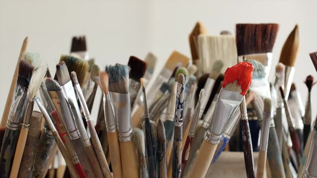 An artist is showing some techniques of painting