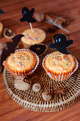 Halloween orange sprinkled cupcakes with pumpkin cream and ghost