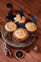 Halloween orange sprinkled cupcakes with pumpkin cream and ghost