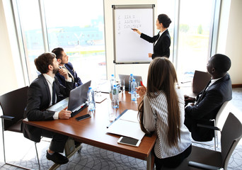 Woman making business presentation to a group