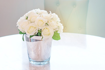 Bouquet of white rose in glass