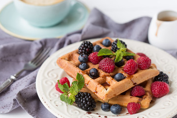 Belgian waffles with berries for breakfast