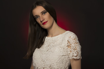 Portrait of pretty fashionable model on dark background