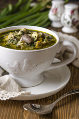 Soup with mushrooms paste offal carrots and herbs  