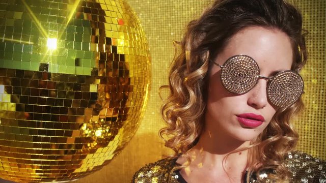 sexy disco woman with gold crystal sunglasses