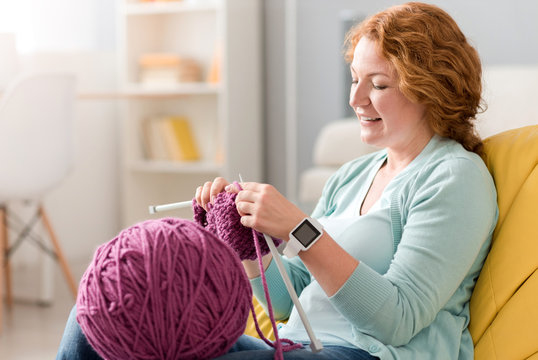 Pleasant Delighted Senior Woman Knitting