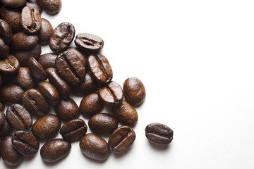 coffee beans spilled on white background
