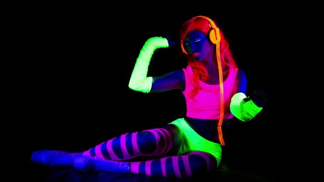 dancer babe fluorescent clothing under UV glow