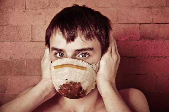 Young Teen Boy Wearing Blood Soaked Surgical Mask