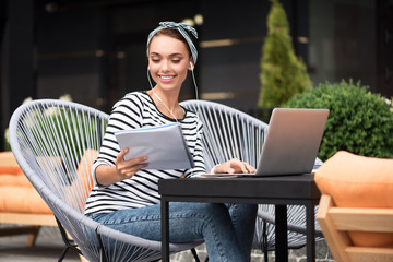 Positive woman using laptop