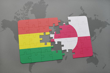 puzzle with the national flag of bolivia and greenland on a world map background.