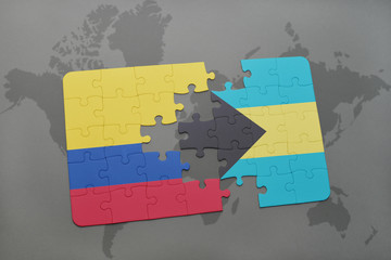 puzzle with the national flag of colombia and bahamas on a world map background.