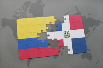 puzzle with the national flag of colombia and dominican republic on a world map background.