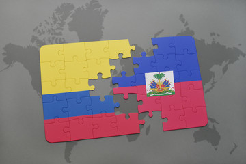 puzzle with the national flag of colombia and haiti on a world map background.