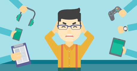 Young man surrounded with his gadgets.