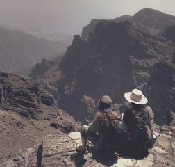Foto op Aluminium Couple of hikers enjoy the panorama of the Canary Islands  © hdsidesign