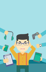 Young man surrounded with his gadgets.