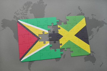 puzzle with the national flag of guyana and jamaica on a world map background.