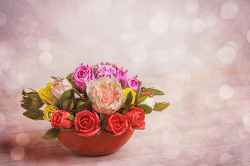 Wooden background with close up of flowers  in the box with free