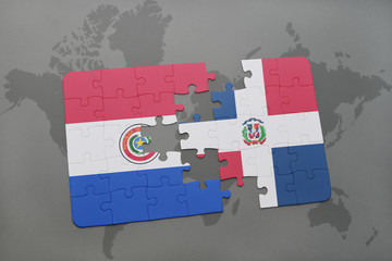 puzzle with the national flag of paraguay and dominican republic on a world map background.