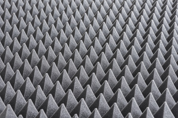 Fototapeta premium Close up of Sound Absorbing Sponge in Recording Studio. Dampening Acoustical Foam in Music Studio. Acoustic Foam Detail.