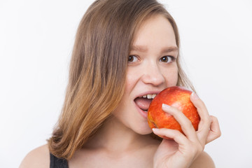 Girl biting apple